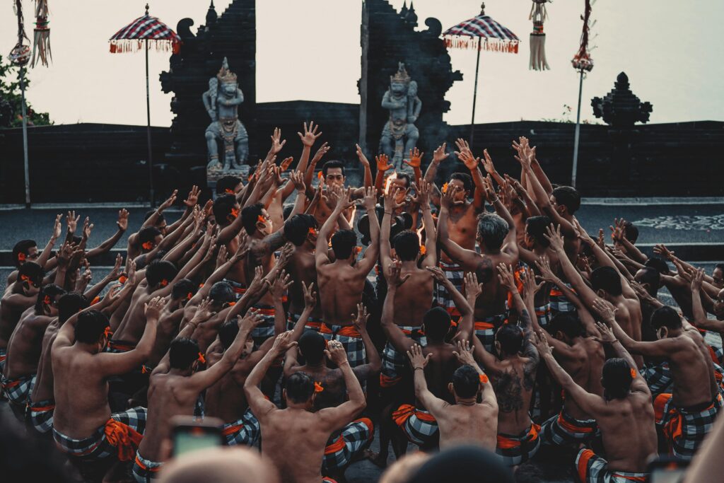 Vibrant Kecak dance performance highlighting Balinese culture and tradition with dancers in outdoor setting.